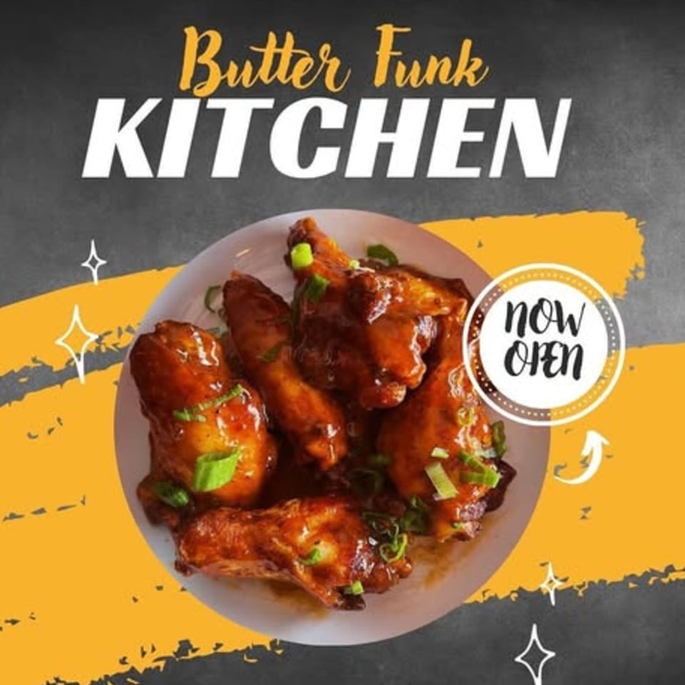 A plate of glazed chicken wings with green onions, advertising Butter Funk Kitchen, now open.